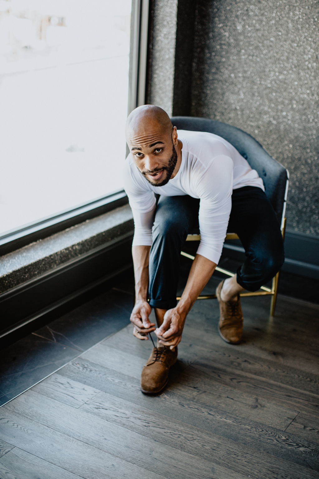 jarreau bowen seated by a window, looking toward the camera